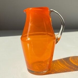 Vintage 5” Small Hand Blown Pumpkin Orange Glass Pitcher with Clear Handle